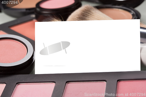 Image of makeup cosmetics for eyes and bussiness card