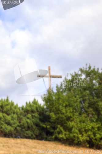 Image of wooden cross near the church