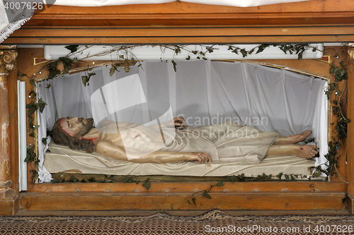 Image of Jesus is laid in the Tomb