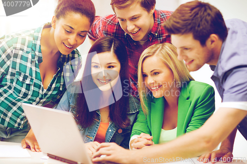 Image of students looking at tablet pc in lecture at school