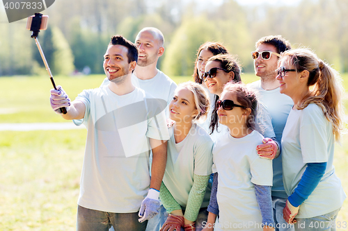 Image of group of volunteers taking smartphone selfie