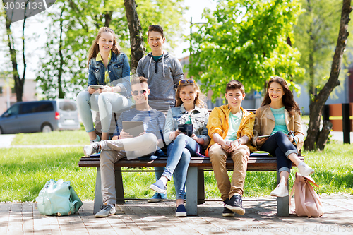 Image of group of students with tablet pc at school yard