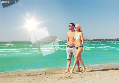 Image of couple walking on the beach