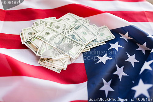 Image of close up of american flag and dollar cash money