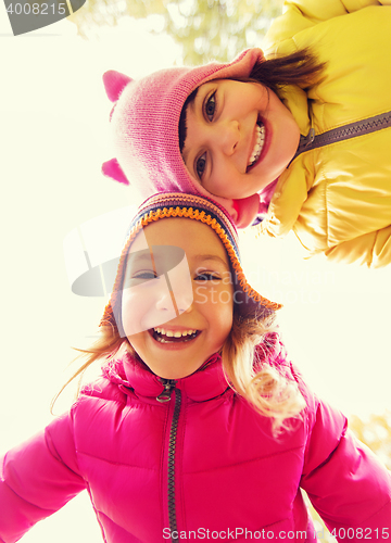 Image of happy girls faces outdoors