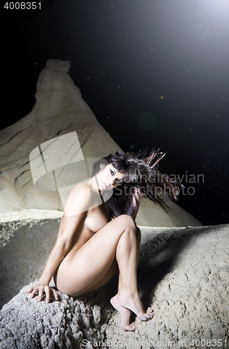 Image of beautiful attractive female body in erotic desert