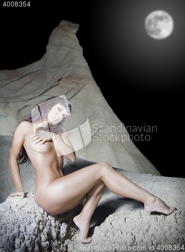 Image of beautiful attractive female body in erotic desert