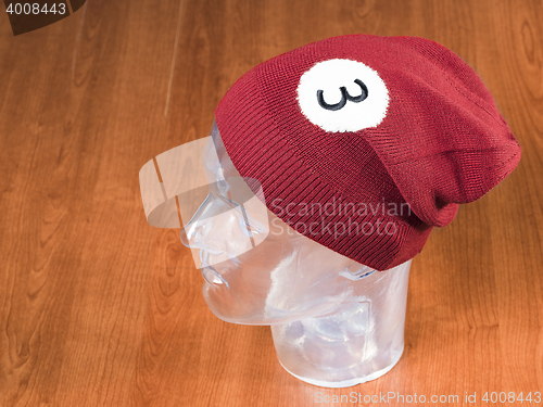 Image of red woolen handmade cap basketball ball alike