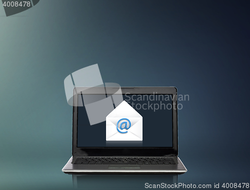 Image of laptop computer with email letter on screen