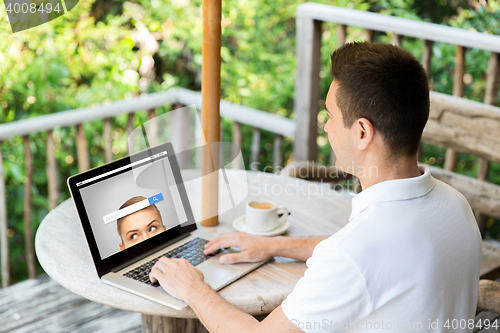Image of close up of businessman with laptop on terrace