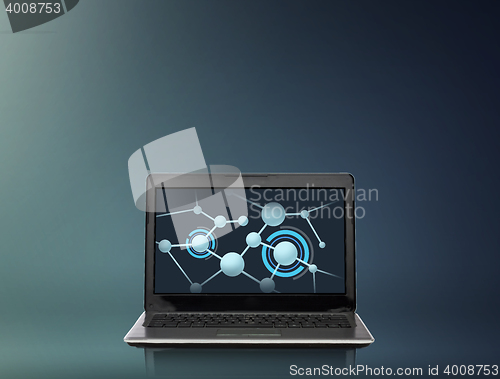 Image of laptop computer with molecules structure on screen