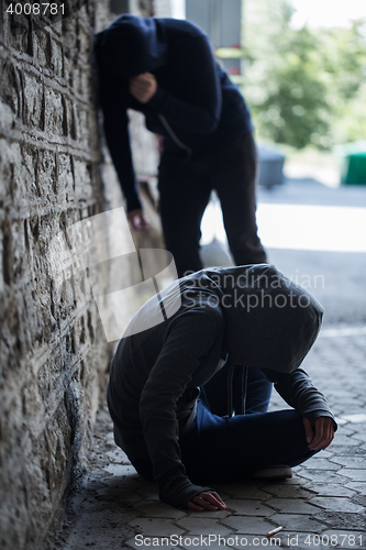 Image of close up of addicts on street