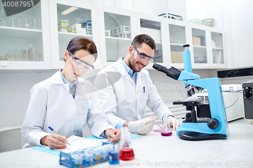 Image of young scientists making test or research in lab