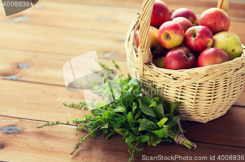 Image of close up of melissa and basket with apples