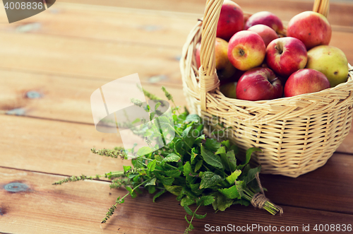 Image of close up of melissa and basket with apples