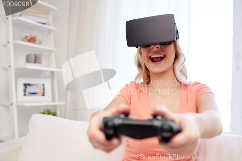 Image of woman in virtual reality headset with controller