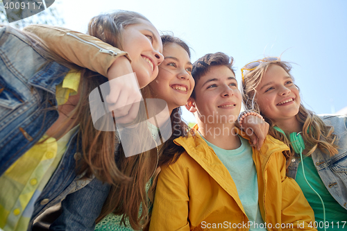 Image of happy teenage students or friends outdoors