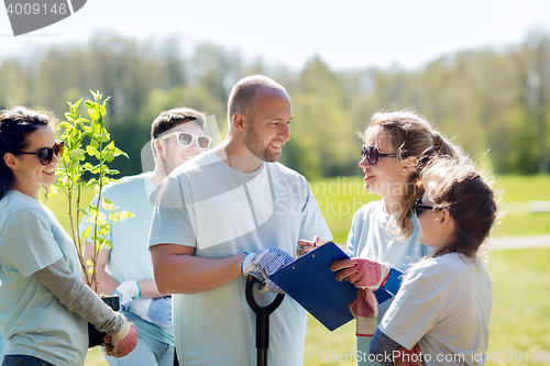 Image of group of volunteers planting trees in park