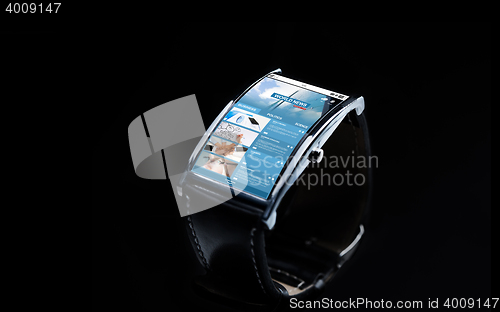 Image of close up of smart watch with business news