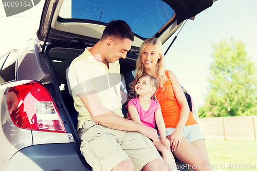 Image of happy family with hatchback car outdoors