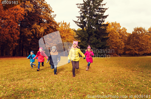Image of group of happy little kids running outdoors