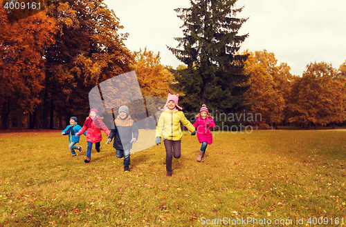 Image of group of happy little kids running outdoors