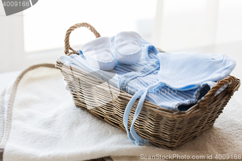 Image of close up of baby clothes for newborn boy in basket