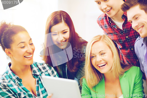 Image of students looking at tablet pc in lecture at school