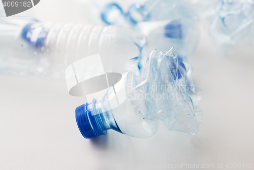 Image of close up of empty used plastic bottles on table