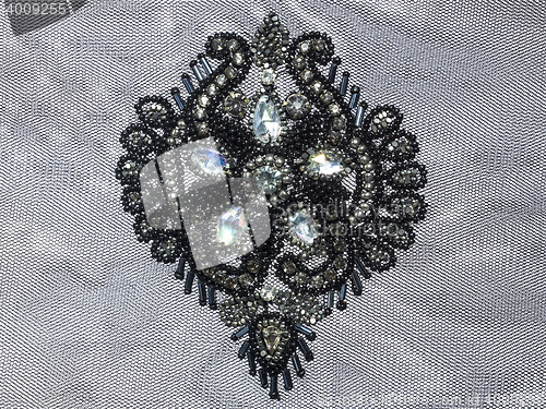 Image of detailed ornament fashion embroidery with rhinestones