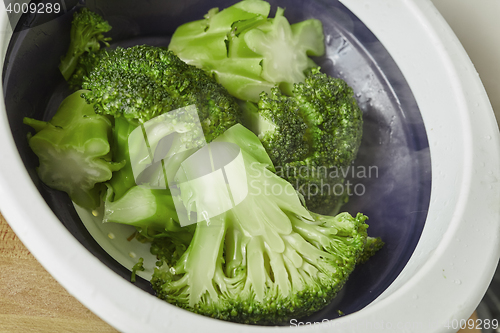 Image of natural pieces of green healthy broccoli just steamed