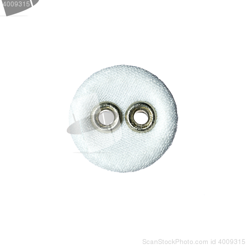 Image of round button with two holes made of fabric