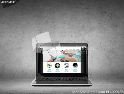 Image of laptop computer with online shop page on screen