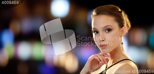 Image of beautiful young asian woman with diamond earring