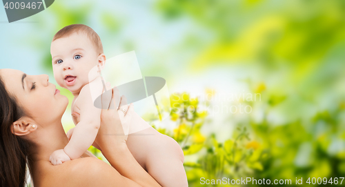 Image of happy mother holding adorable baby