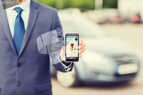 Image of close up of business man with smartphone navigator