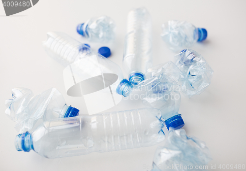 Image of close up of empty used plastic bottles on table