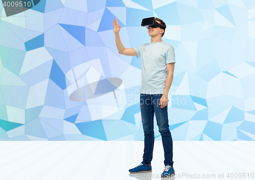 Image of happy man in virtual reality headset or 3d glasses