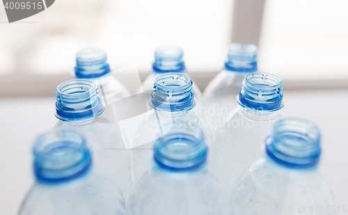 Image of close up of empty used plastic bottles on table