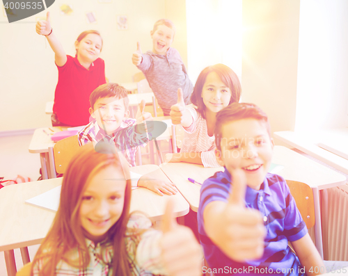 Image of group of school kids showing thumbs up