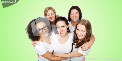 Image of group of happy different women in white t-shirts