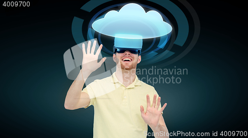 Image of happy man in virtual reality headset or 3d glasses