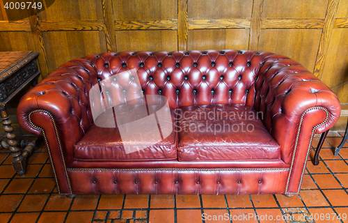 Image of close up of vintage leather sofa