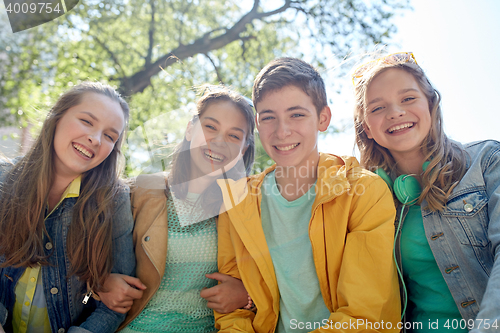 Image of happy teenage students or friends outdoors