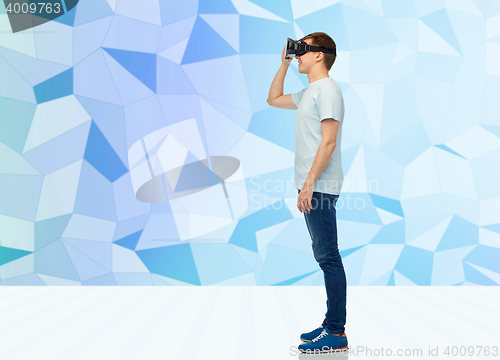 Image of happy man in virtual reality headset or 3d glasses