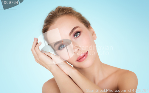 Image of beautiful young woman face and hands