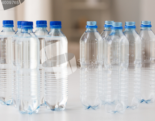 Image of close up of bottles with drinking water on table