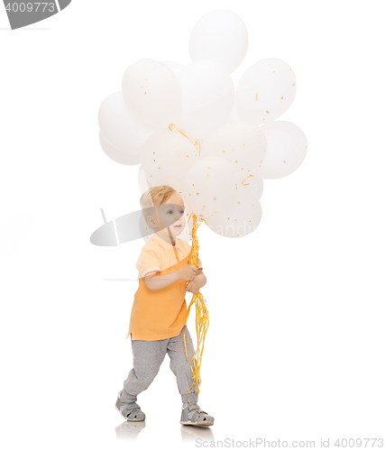 Image of happy little baby boy with bunch of balloons