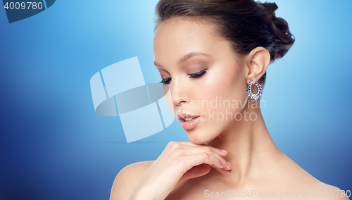 Image of close up of beautiful woman face with earring