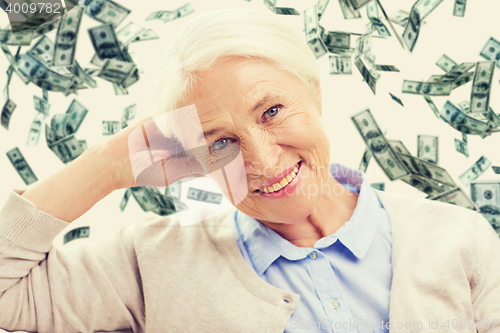 Image of happy senior woman face over violet background